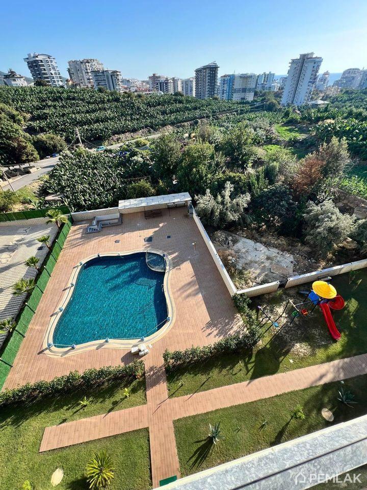 Mahmutlar mahallesinde konforlu yaşam için şık 1+1 daire - image 1