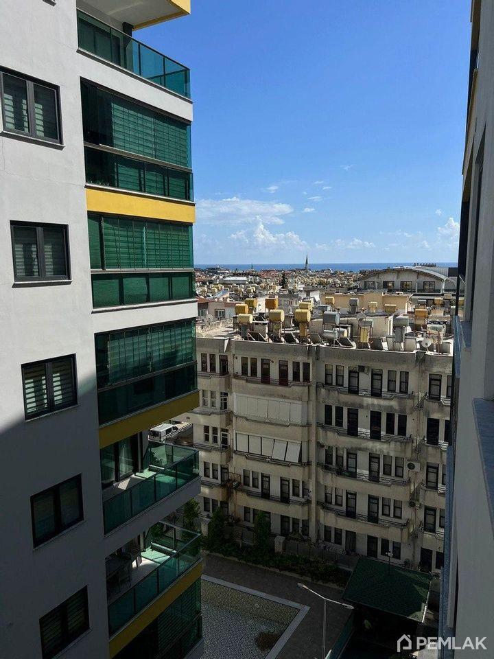 Alanya'nın merkezinde Konak City Tower kompleksinde dağ manzaralı modern 1+1 daire - image 1